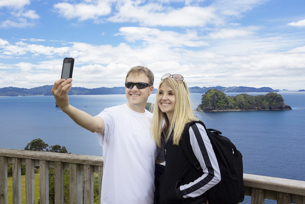 Couple taking selfie over tourist point